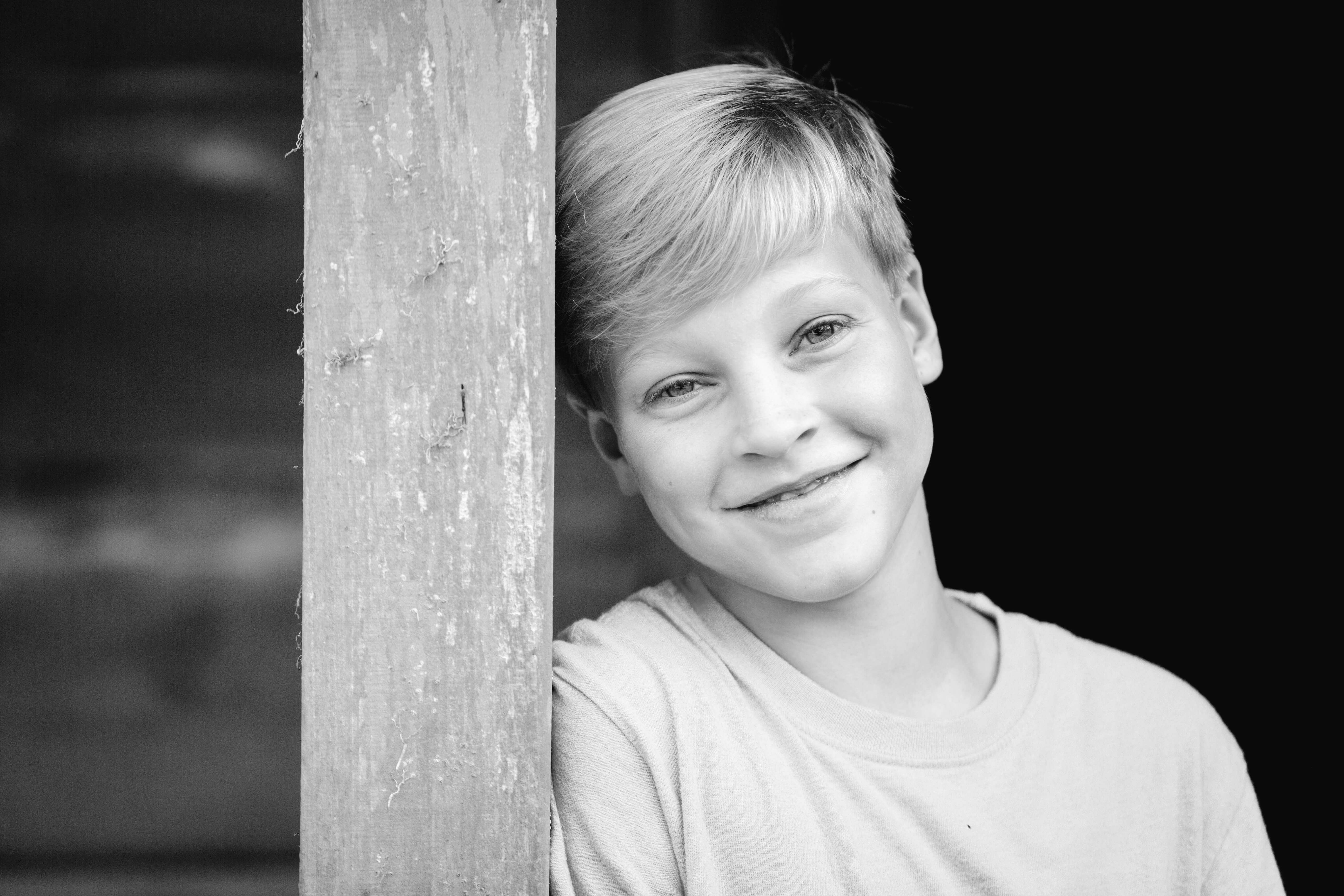 boy smirking in jackson lake island alabama